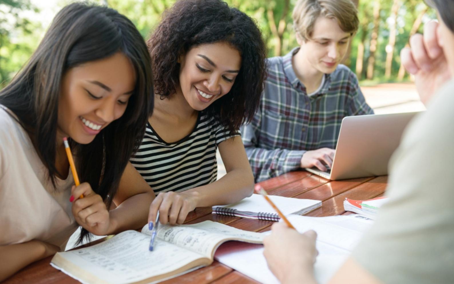 Team meeting with multiple workstations and testing devices